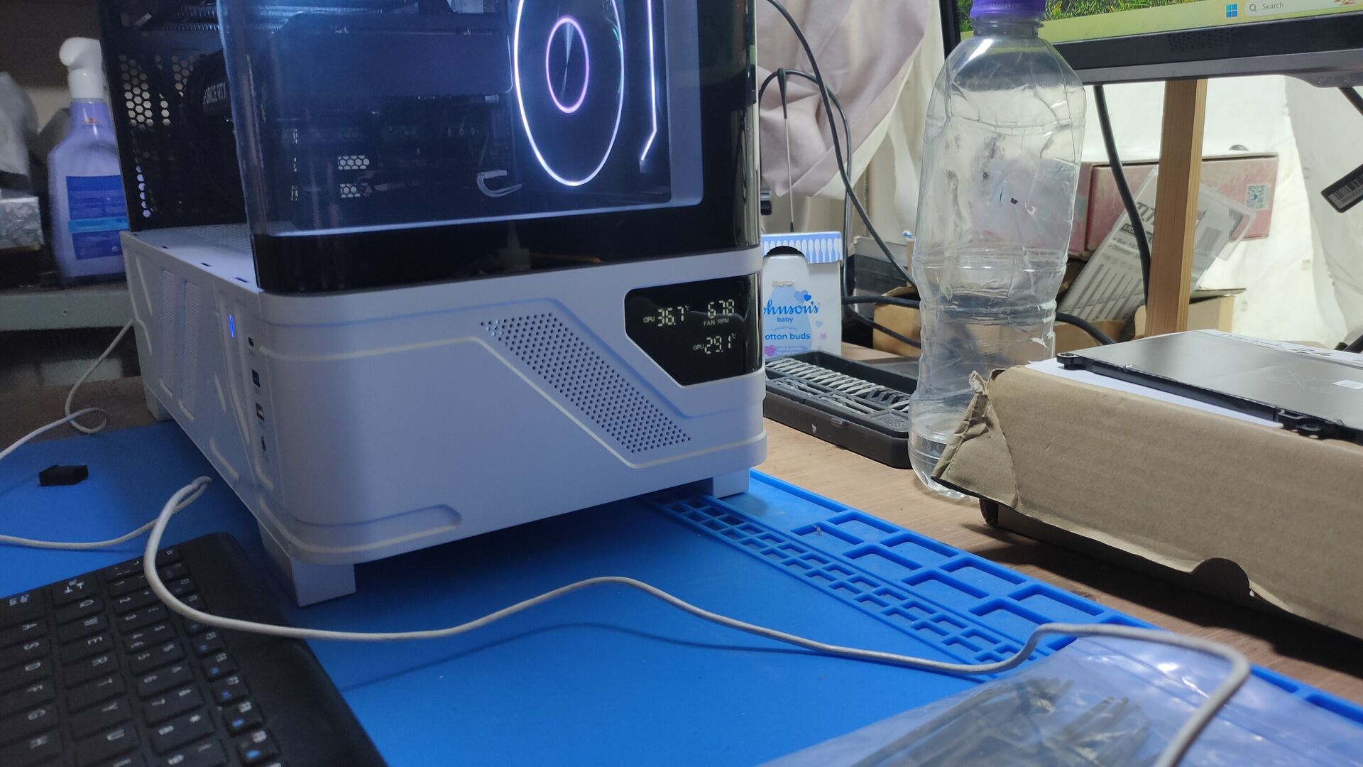 Unedited side view of AJ's Powercool Arctic White case showing the front temperature display and lit rear fan