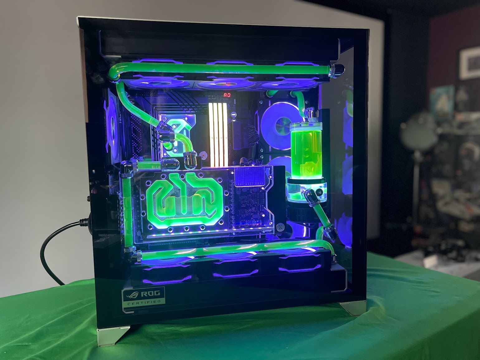 Original September 2023 photograph of Dan's completed water-cooled PC on a green sheet
