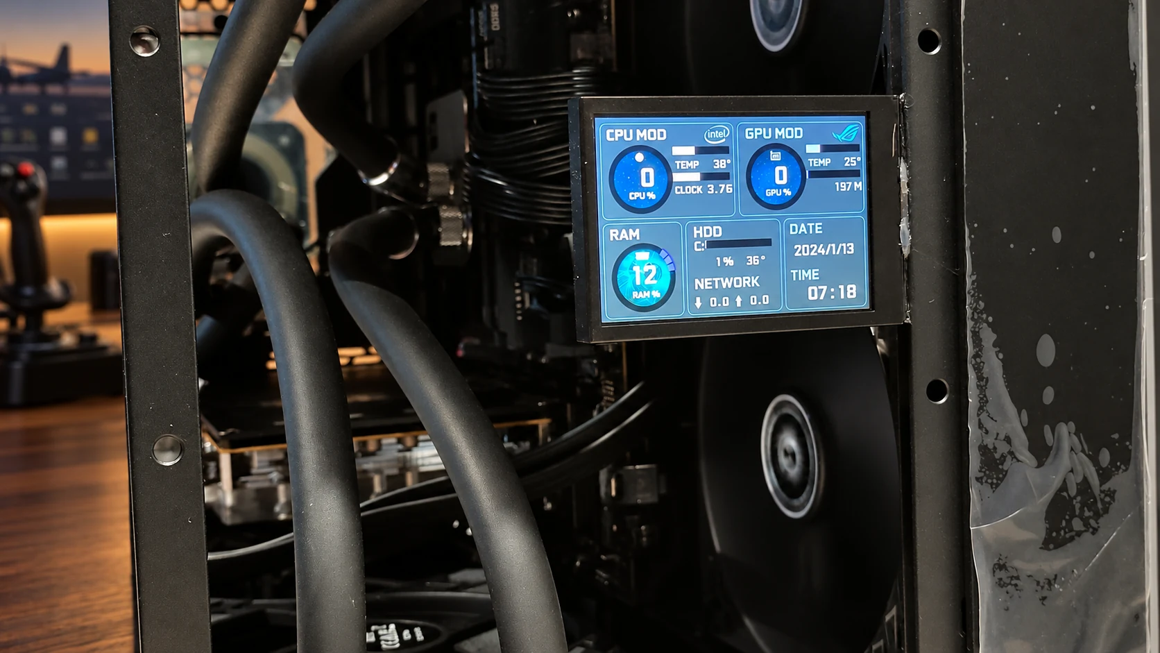 Closer view of the small LCD status display inside David's black flight-simulator PC, with an AI-edited background