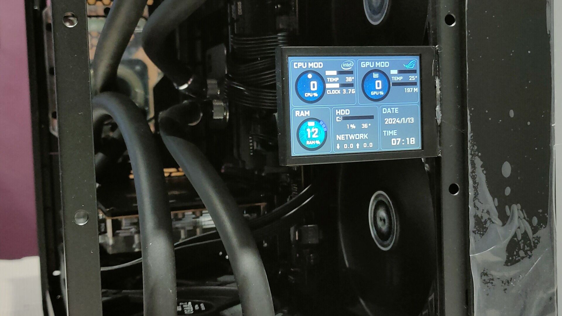Unedited January 2024 close-up of the LCD status display and cooling tubes inside David's PC