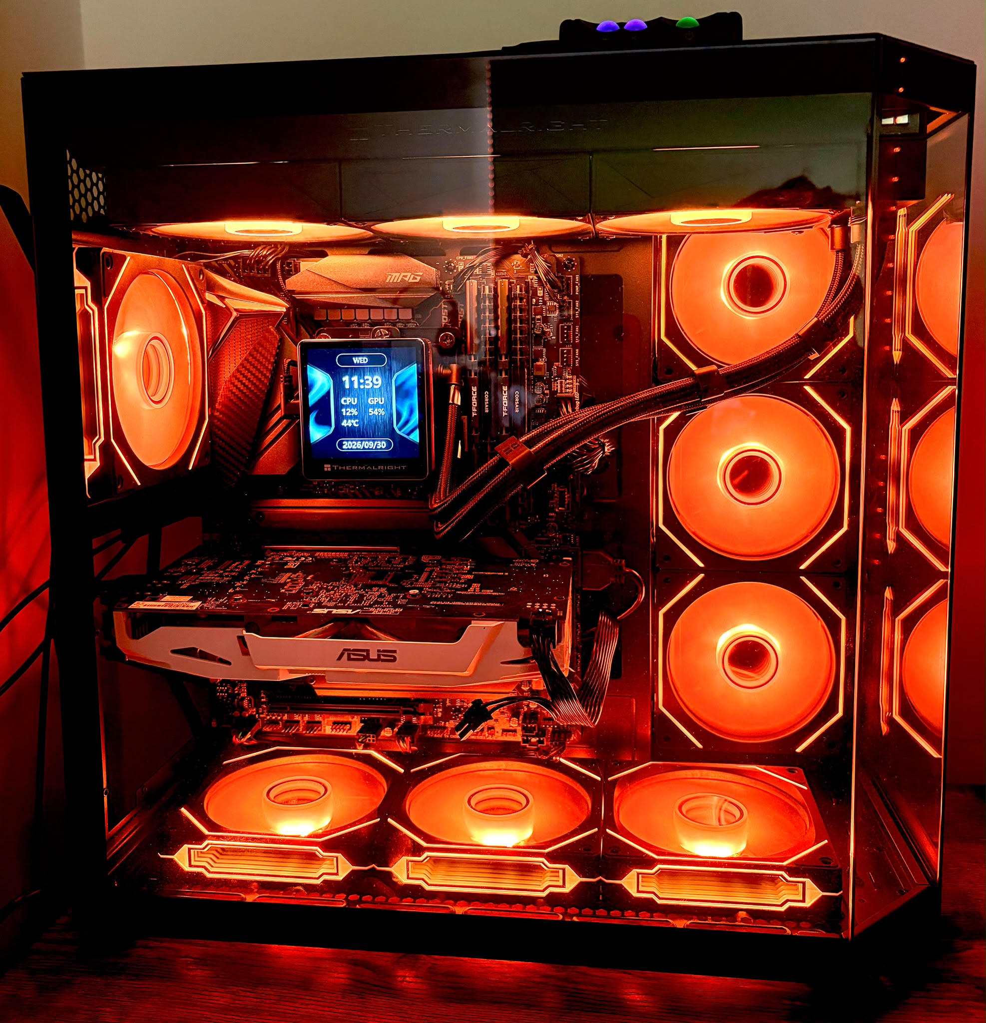 Theo's unedited customer photograph of his orange-lit gaming PC